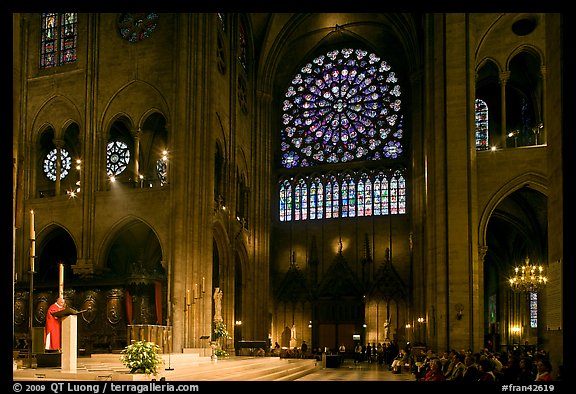 Bishop celebrating mass, South transept, and stained glass rose. Paris, France (color)
