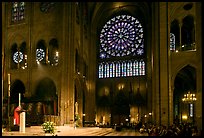 Bishop celebrating mass, South transept, and stained glass rose. Paris, France (color)