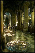 Candles in aisle, Notre-Dame-de-Paris. Paris, France