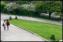 Couple walking down steps in park, Montmartre. Paris, France