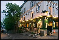 Couple looking at menu outside restaurant, Montmartre. Paris, France ( color)