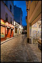 Pedestrian cobblestone street and tourist business, Montmartre. Paris, France