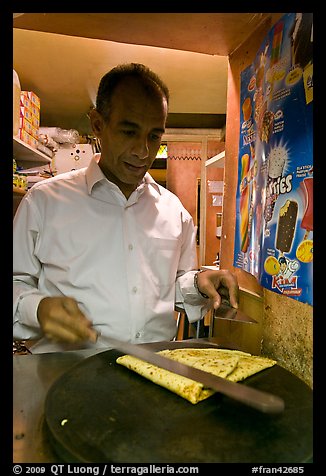 Man preparing a crepe, Montmartre. Paris, France (color)