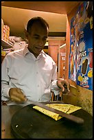 Man preparing a crepe, Montmartre. Paris, France