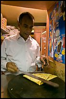 Man preparing a crepe, Montmartre. Paris, France (color)