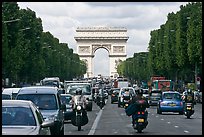 Car and motorcycle traffic and Arc de Triomphe, Champs-Elysees. Paris, France