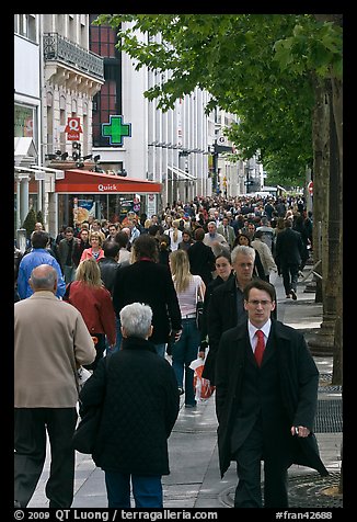 Dense pedestrian traffic on Champs-Elysees. Paris, France