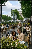 Couple at outdoor cafe on the Champs-Elysees. Paris, France