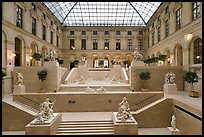 Louvre Museum room with sculptures and skylight. Paris, France (color)