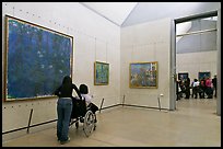 Tourist in wheelchair, Orsay Museum. Paris, France (color)