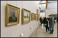 Couple looking at impressionists paintings, Orsay Museum. Paris, France ( color)