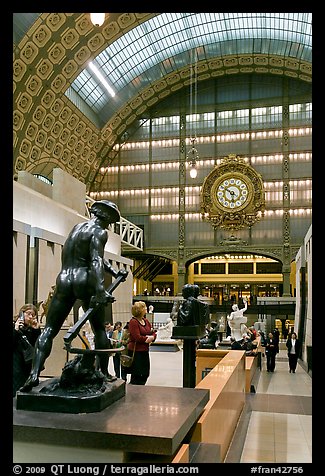 Sculpture and historic clock inside Orsay Museum. Paris, France (color)