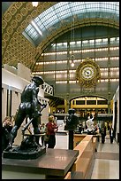 Sculpture and historic clock inside Orsay Museum. Paris, France (color)