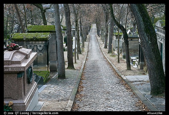 Alley and tombs in winter, Pere Lachaise cemetery. Paris, France