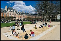 Children playing in sandbox, Place des Vosges. Paris, France (color)