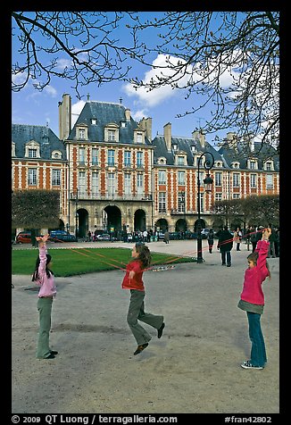 Girls playing with rope, Place des Vosges. Paris, France (color)