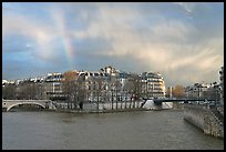 Clearing storm with rainbow above Saint Louis Island. Paris, France