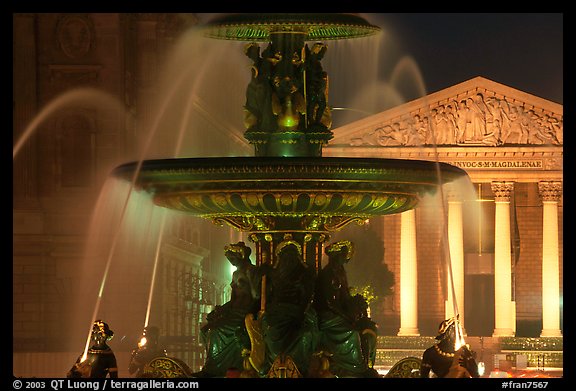 Fountain on Place de la Concorde and Madeleine church at night. Paris, France