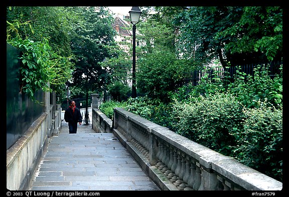 Alley borded by gardens, Montmartre. Paris, France