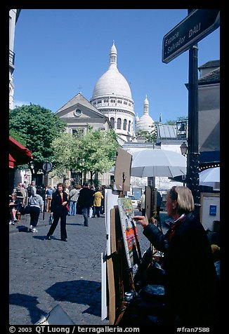 Painter on Place du Tertre, with the Sacre Coeur in the background, Montmartre. Paris, France