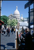 Painter on Place du Tertre, with the Sacre Coeur in the background, Montmartre. Paris, France ( color)