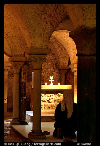 Nun in prayer in the Crypte of the Romanesque church of Vezelay. Burgundy, France