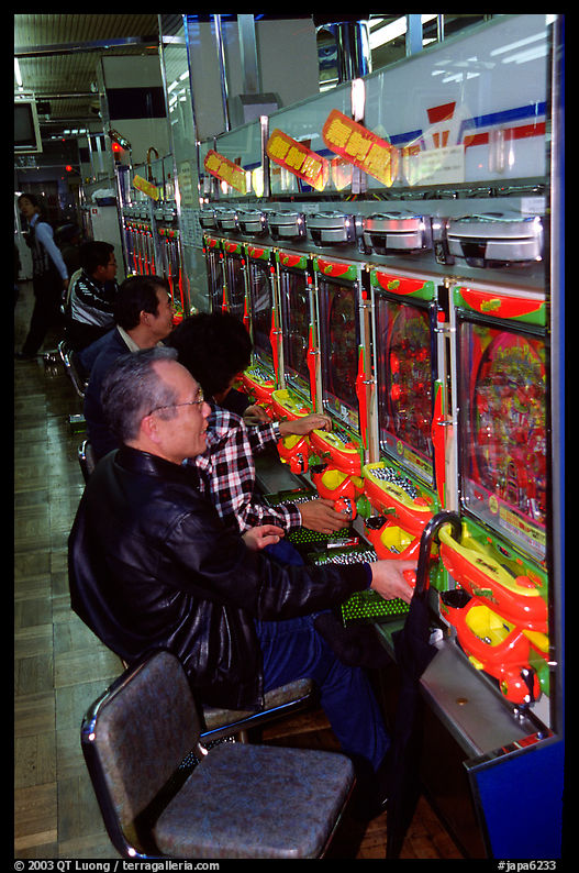 Playing a gambling maching. Tokyo, Japan