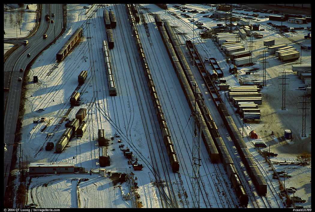 Rail tracks and cargo cars in winter. Calgary, Alberta, Canada