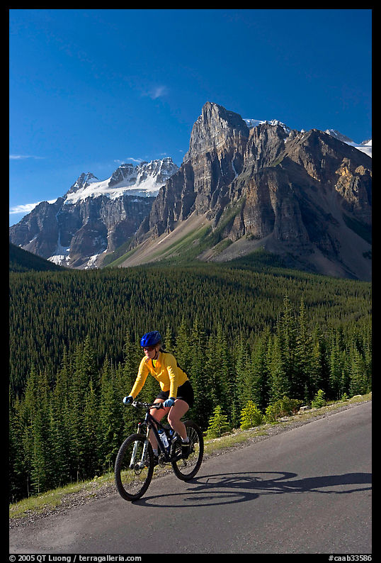 Cyclist on the road to the Valley of Ten Peaks. Banff National Park, Canadian Rockies, Alberta, Canada