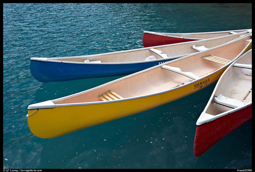 Close up of brightly colored canoes, Moraine Lake. Banff National Park, Canadian Rockies, Alberta, Canada