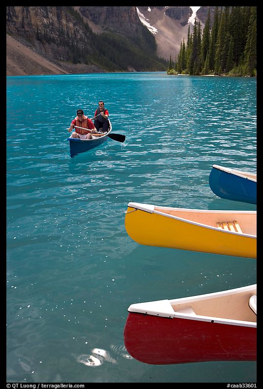 Colorful canoes and conoeists on Moraine Lake. Banff National Park, Canadian Rockies, Alberta, Canada