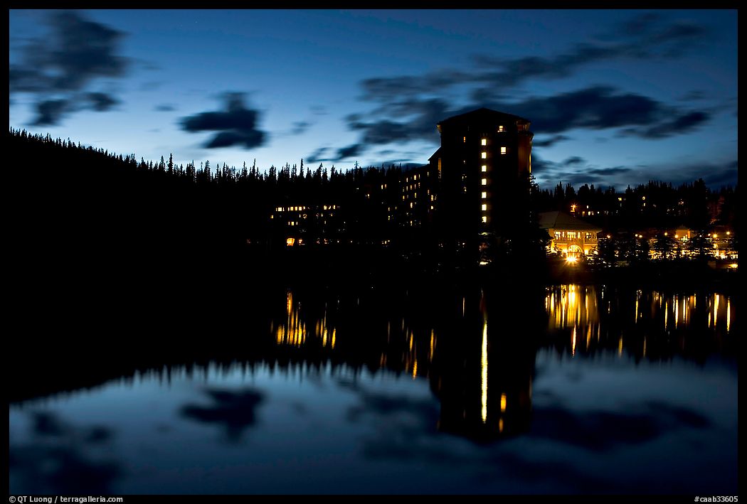 Chateau Lake Louise Hotel reflected in Lake at night. Banff National Park, Canadian Rockies, Alberta, Canada