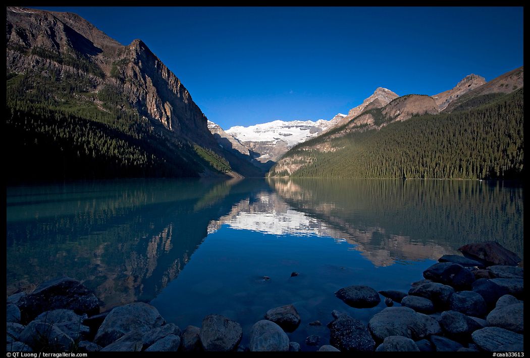 Mountains reflected in Lake Louise, early morning. Banff National Park, Canadian Rockies, Alberta, Canada