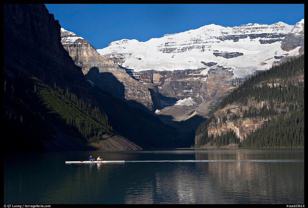 Rower, Lake Louise, and Victoria Peak, early morning. Banff National Park, Canadian Rockies, Alberta, Canada