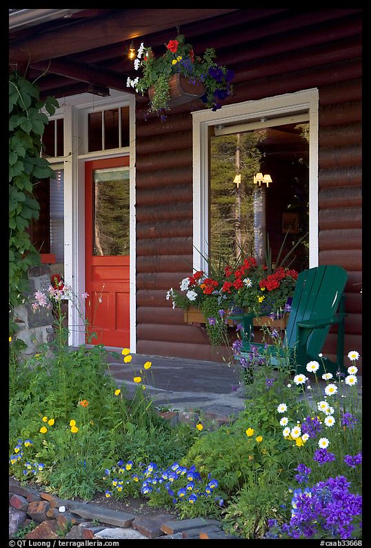 Flowered porch of a wooden cabin. Banff National Park, Canadian Rockies, Alberta, Canada