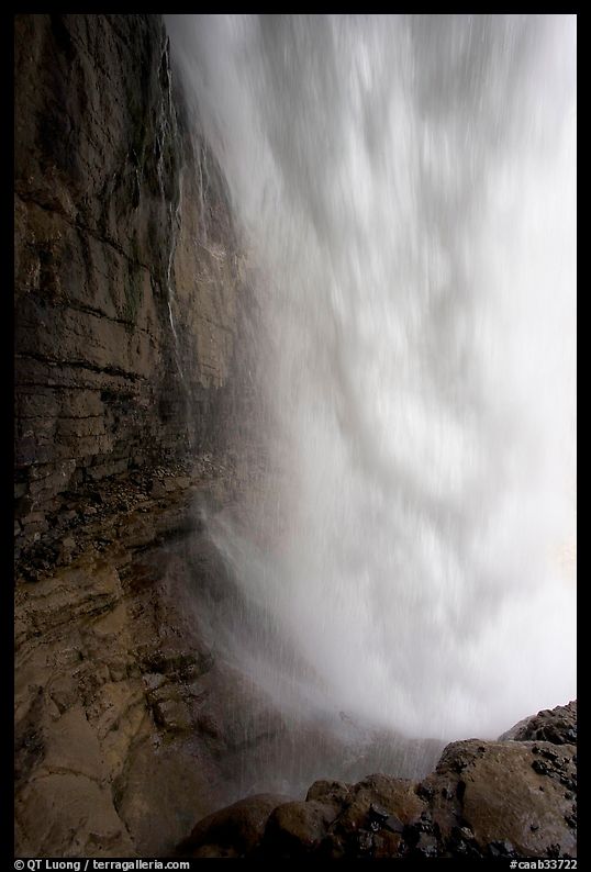 Curtain of water of Panther Falls, seen from behind. Banff National Park, Canadian Rockies, Alberta, Canada