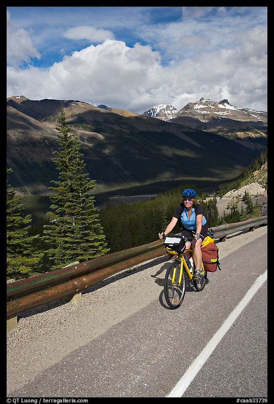 Woman cyclist, Icefieds Parkway. Jasper National Park, Canadian Rockies, Alberta, Canada