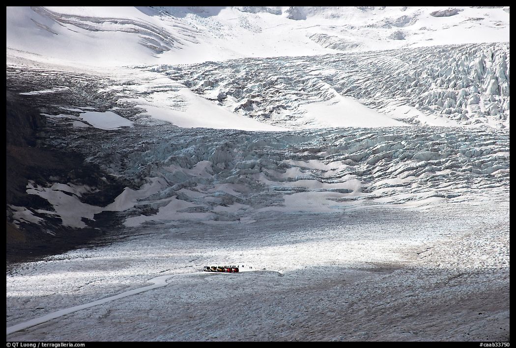 Distant view of snowcoaches parked at the base of the lower icefall on the Athabasca Glacier. Jasper National Park, Canadian Rockies, Alberta, Canada