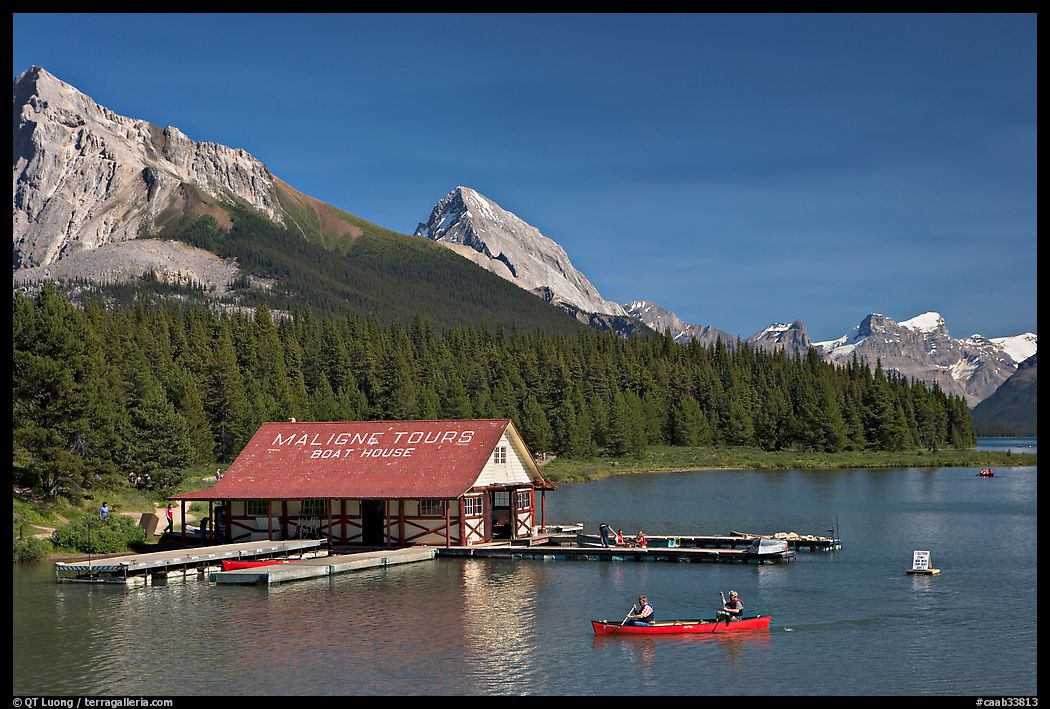 Boat house and canoe beneath Leh and Samson Peaks,  Maligne Lake. Jasper National Park, Canadian Rockies, Alberta, Canada