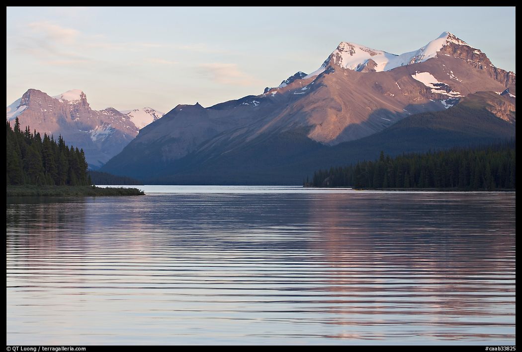 Peaks reflected in rippled water, Maligne Lake, sunset. Jasper National Park, Canadian Rockies, Alberta, Canada