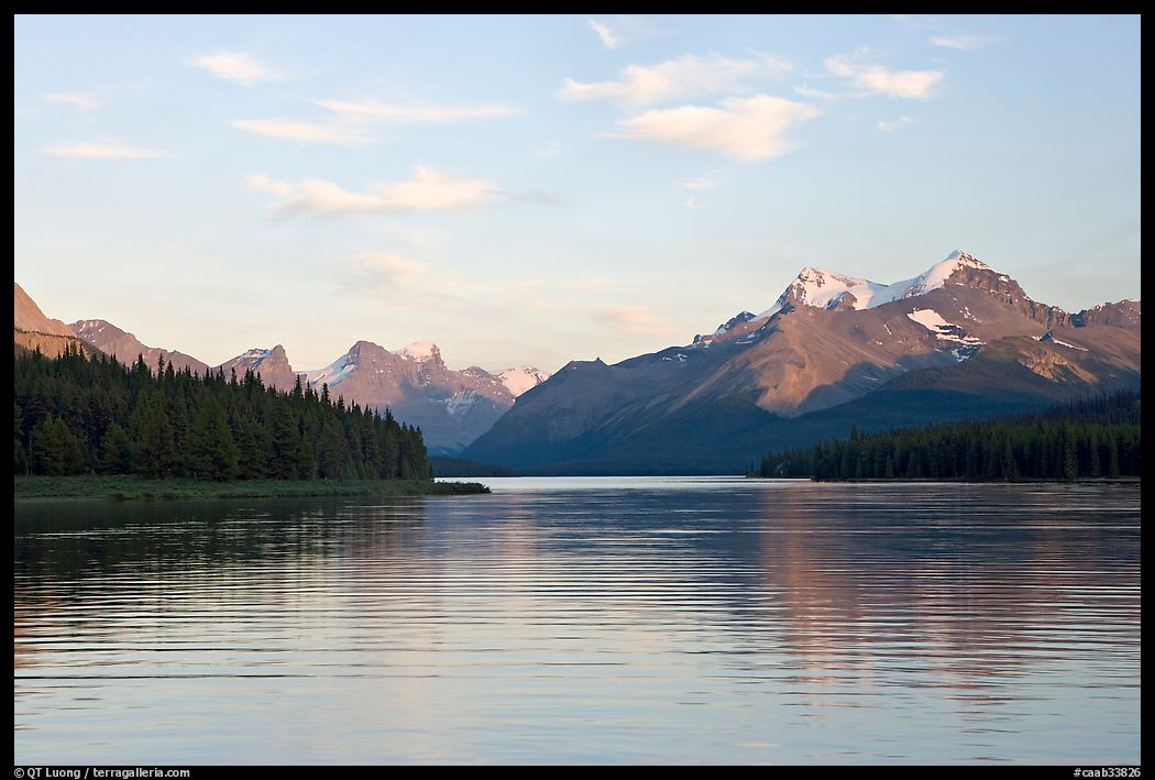 Serene view of Maligne Lake and peaks, sunset. Jasper National Park, Canadian Rockies, Alberta, Canada