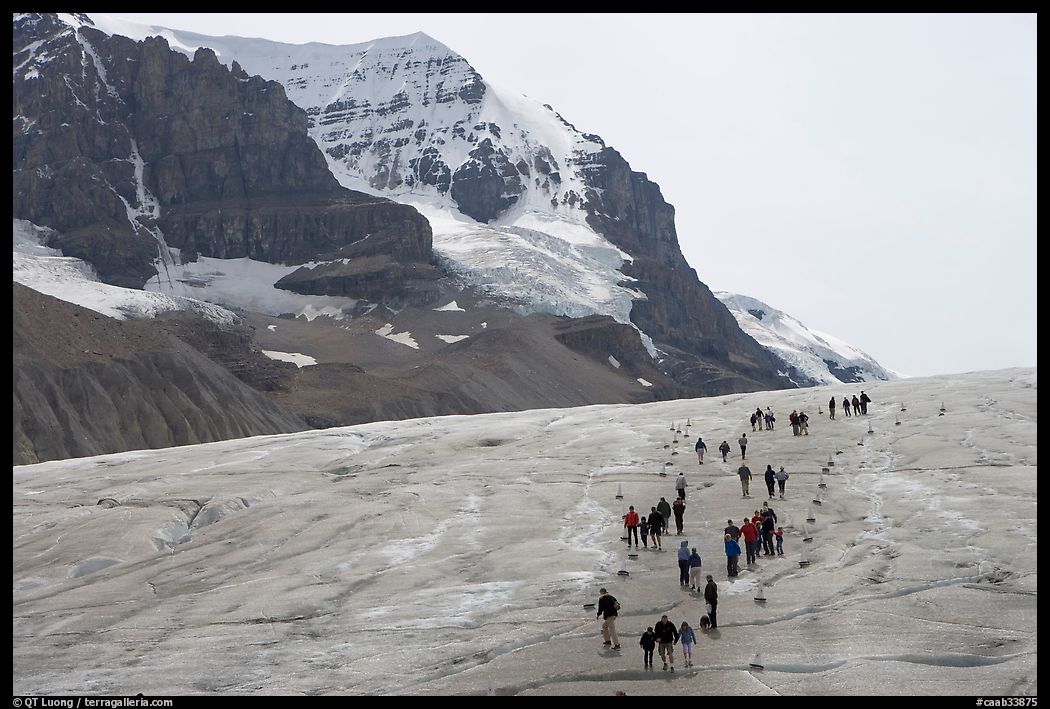 People amongst glacier and peaks, Columbia Icefield. Jasper National Park, Canadian Rockies, Alberta, Canada