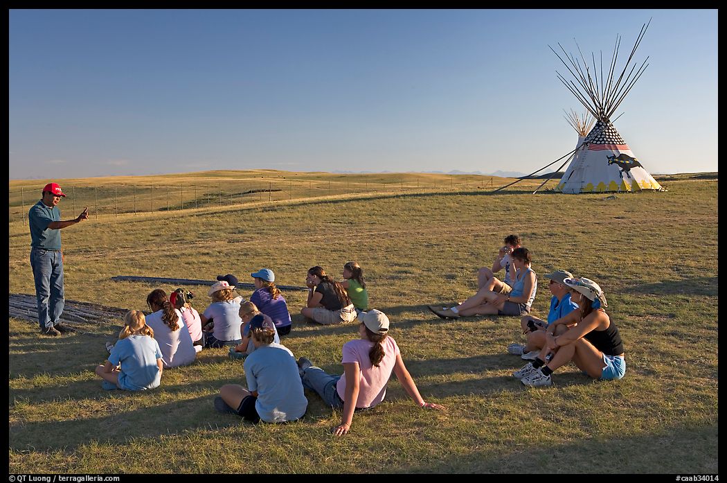 First nations man giving a lecture to students, Head-Smashed-In Buffalo Jump. Alberta, Canada