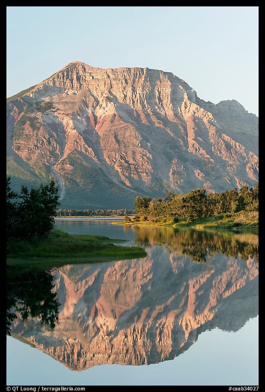 Mountain and reflexion in Middle Waterton Lake, sunrise. Waterton Lakes National Park, Alberta, Canada