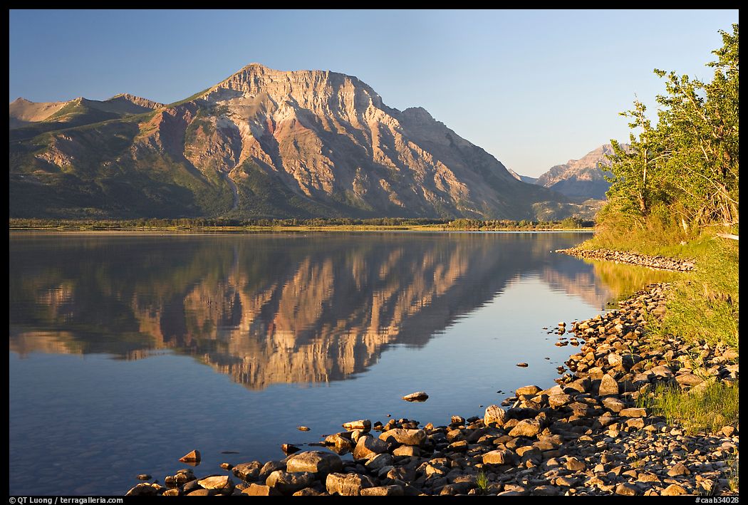 Shoreline with pebbles, Middle Waterton Lake, and Vimy Peak. Waterton Lakes National Park, Alberta, Canada