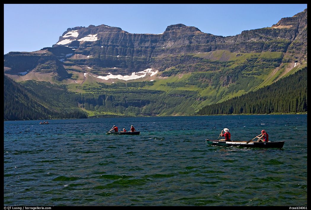 Canoists on Cameron Lake. Waterton Lakes National Park, Alberta, Canada