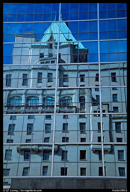 Buildings reflected in the glass windows of a high-rise buildings. Vancouver, British Columbia, Canada