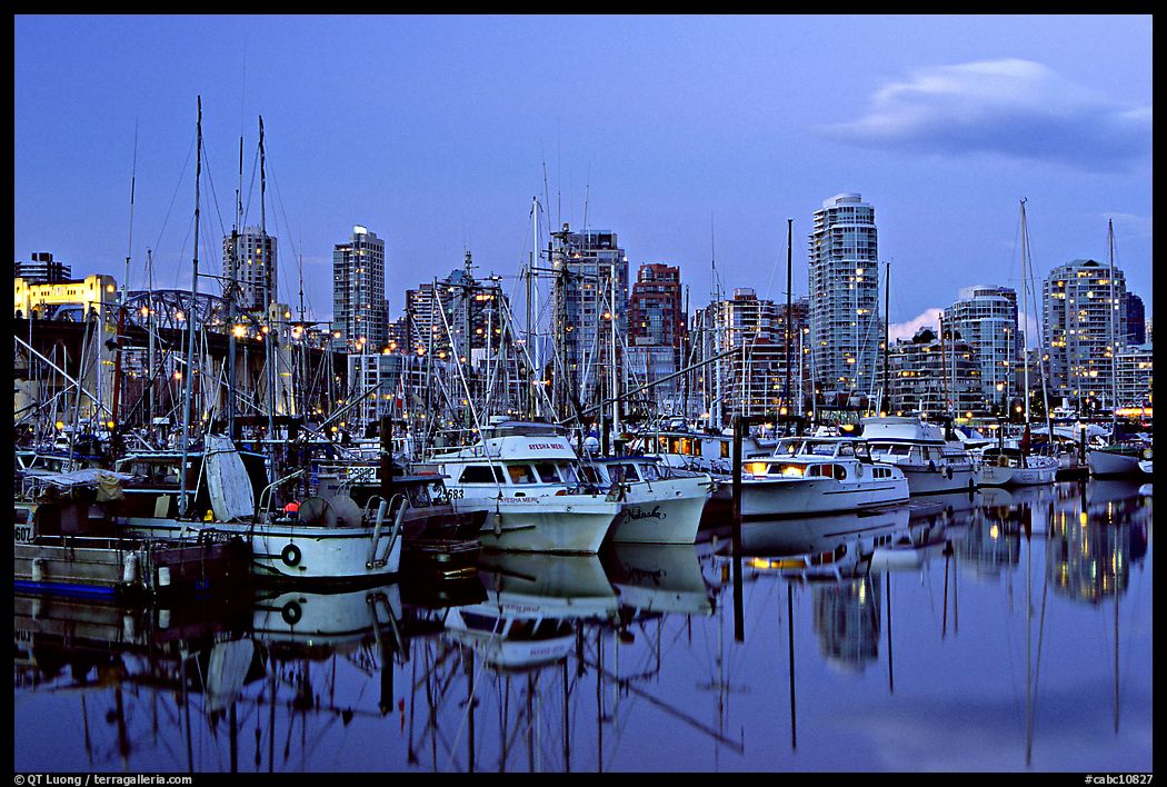 Small boat harbor and skyline at dusk. Vancouver, British Columbia, Canada