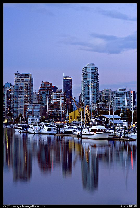 Small boat harbor and skyline at dusk. Vancouver, British Columbia, Canada