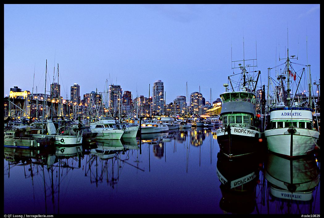 Fishing boats and skyline at dusk. Vancouver, British Columbia, Canada